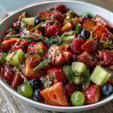 Vibrant strawberry lemonade fruit salad with fresh strawberries, blueberries, and watermelon, tossed in a zesty lemon-honey dressing for a refreshing summer treat.