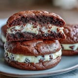 Cream cheese stuffed brownie mix cookies with gooey chocolate centers and a tangy cream cheese filling.