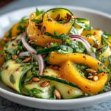Refreshing Mango Cucumber Tajín Ribbon Salad, perfect summer appetizer with spicy Tajín kick.