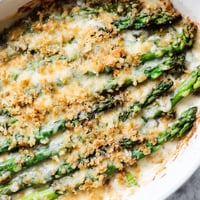 Freshly baked Asparagus Casserole with bubbly golden cheese and crispy breadcrumbs served hot from the oven.